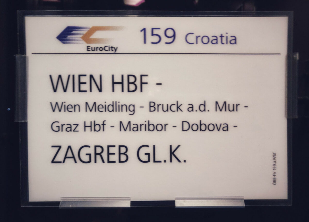 Train destination sign of the EC 159 "CROATIA", with theEUROCITY Logo on it, it is a Blue "E" and a Golden "C"